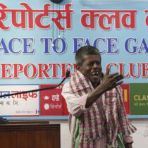 person speaking at stand