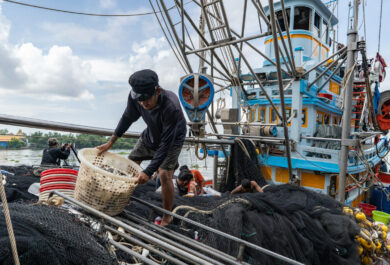 Fishing industry in Samut Sakhon, Thailand. Thailand is a top 5 global seafood producer, with exports reaping over $7 billion. But the profitable industry supplying consumers around the world with cheap seafood comes at a high cost to both the environment and to workers. The overwhelming majority of workers in Thailands fishing and seafood processing industries are migrants from Myanmar, Laos and Cambodia. Labour brokers recruit from vulnerable communities, promising favourable employment in the construction, manufacturing, or agriculture industries. Migrants often incur debt from their recruitment, fees and costs associated with transportation and securing employment in Thailand. These debts are paid off through deductions from workers earnings with employers and brokers frequently using debt manipulation to inflate the amounts and force people into bonded labour. This and the other images in this collection are showing the context in which the Freedom Fund Thailand hotspot operates. They show the location as well as the boats on which migrant workers work. They also show facilities for processing seafood and the markets in which seafood is traded. We do not have names or stories of any of the individuals shown in this collection because that was not the purpose of this commission. Jittrapon Kaicome / The Freedom Fund